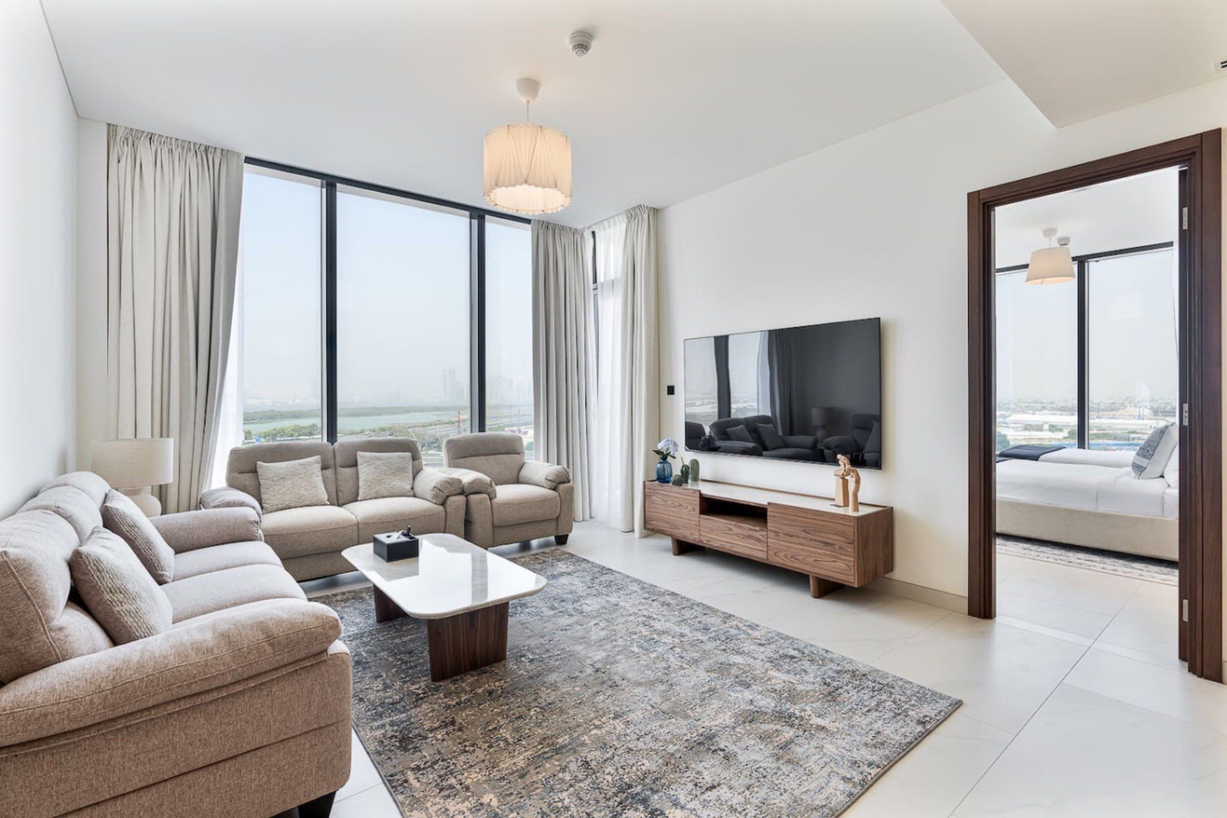 Living room of an Amare holiday home overlooking the Dubai skyline